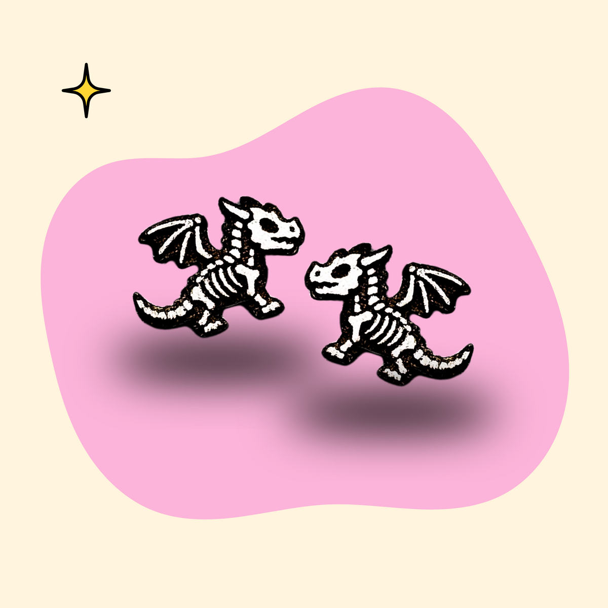 Hand-painted wooden dragon skeleton ear studs in black and white by GRAINN