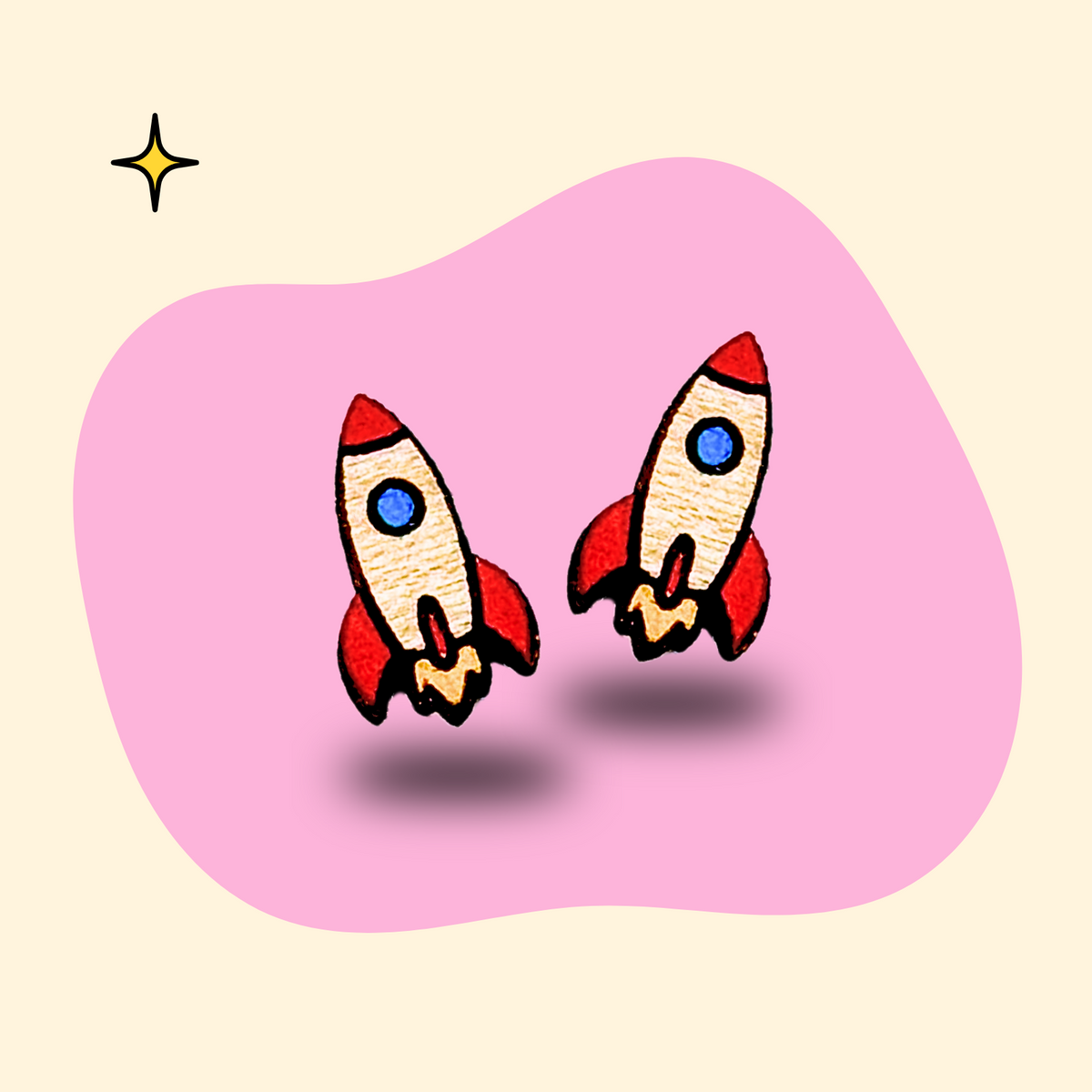 Hand-painted wooden rocket ship ear studs by GRAINN