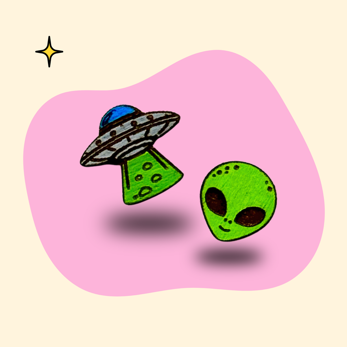 Hand-painted wooden UFO and alien ear studs by GRAINN